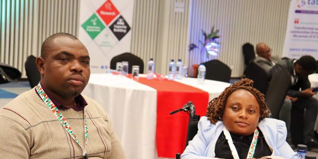 A picture of two Participants during the KIGF 2024. One seated on a chair while the other is on a wheelchair