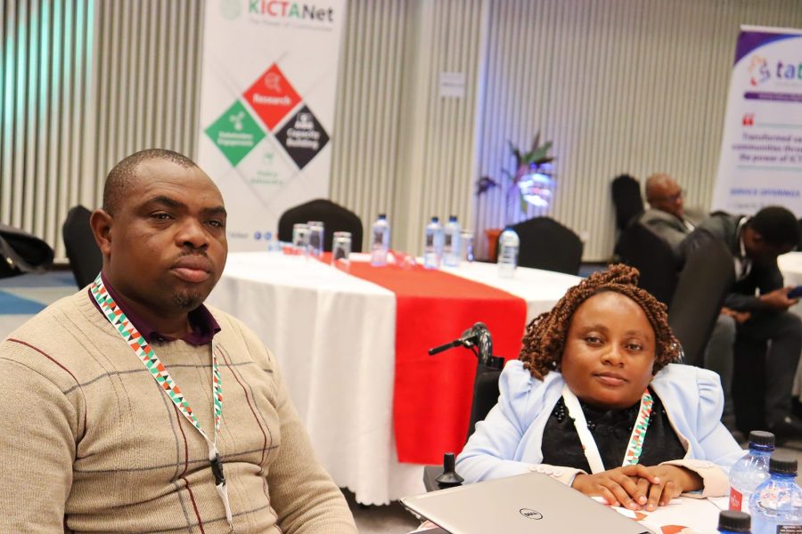 A picture of two Participants during the KIGF 2024. One seated on a chair while the other is on a wheelchair