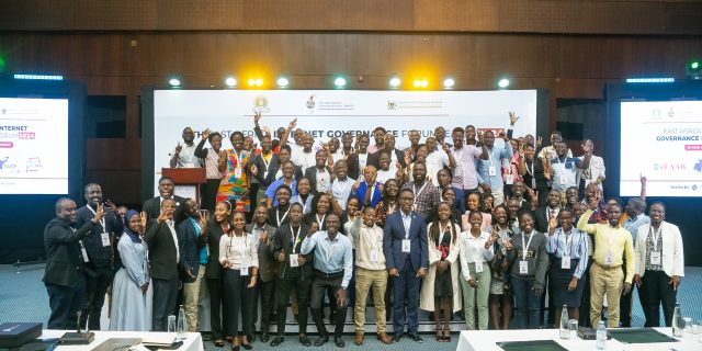 A group phoyo of EAIGF 2024 participants standing on a podium