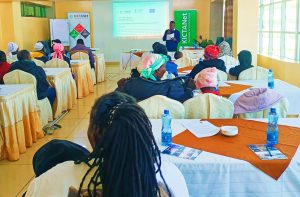 A photo of Nicodemus Nyakundi conducting a training for women with disabilities in Nakuru