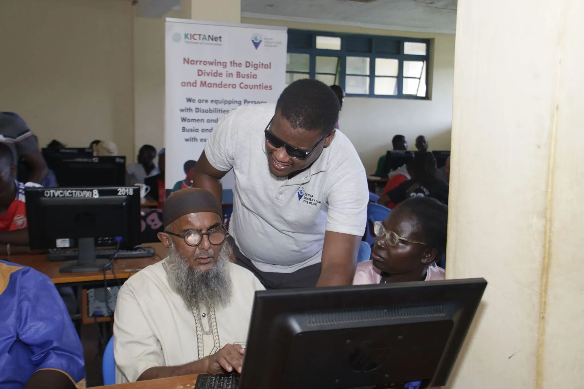 Kenya Society for the Blind at the Okame Technical and Vocational College in Busia County training basic computer navigation for persons with disabilities under the Digital Access Programme.