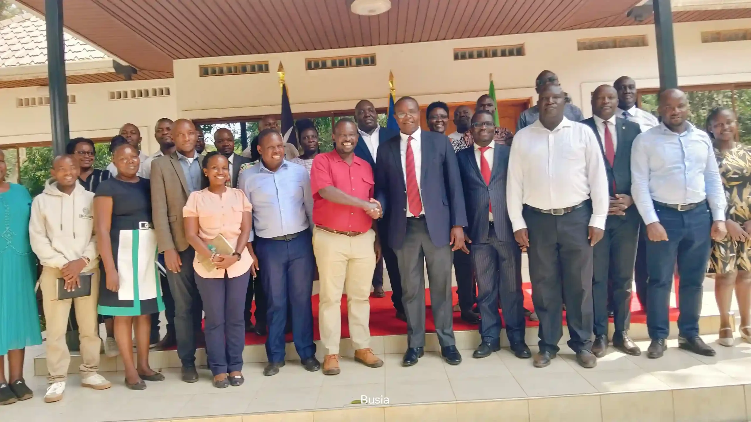 Busia County Governor Dr. Paul Nyongesa Otuoma and UK-AID's Mr Charles Juma (UK-Digital Access Program Country Lead and Advisor)  shake hands during a courtesy visit to the Governors' office to report on the impact of the Strengthening Digital Communities project in the county.